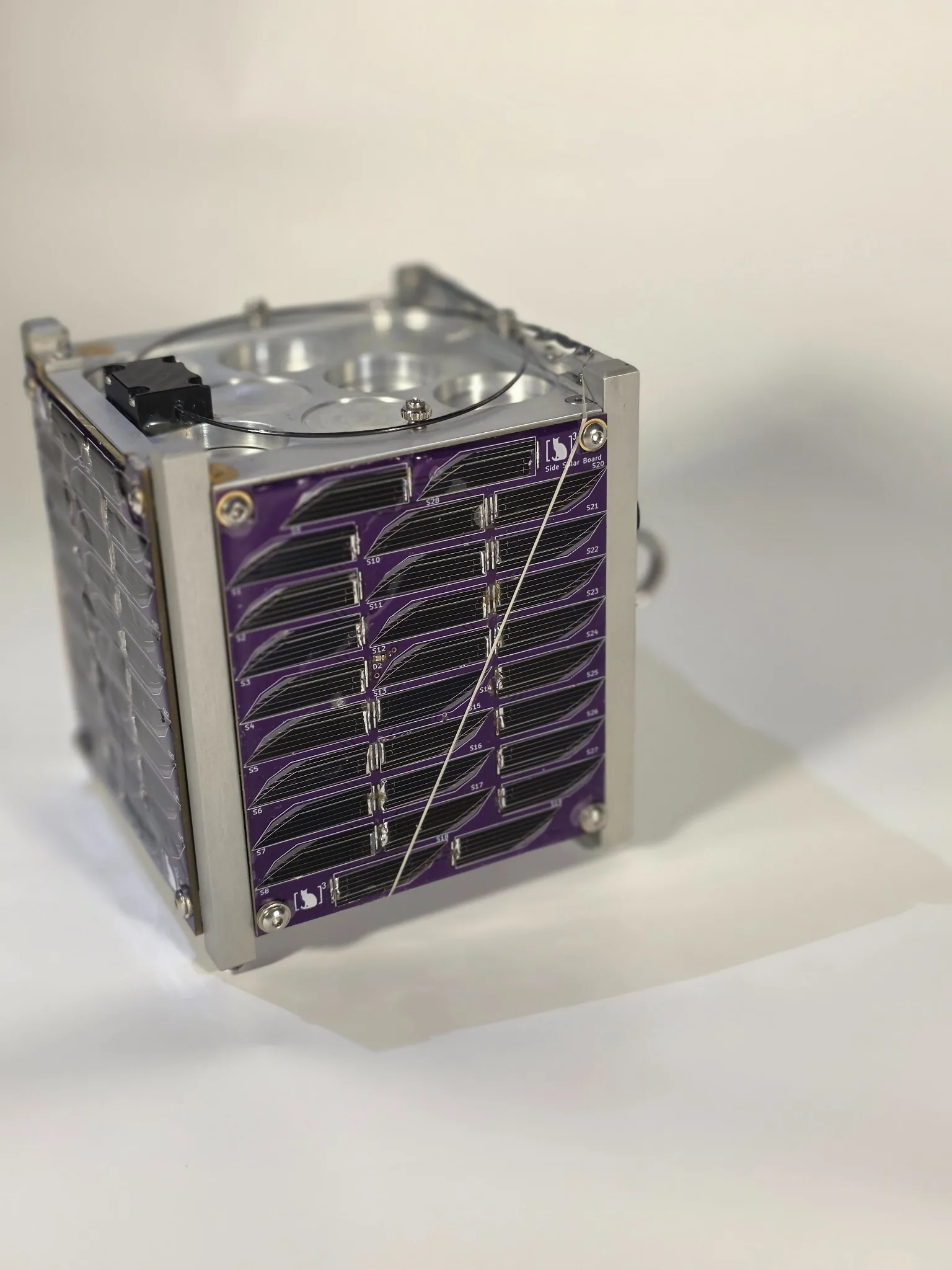LEOPARDSat-1 spacecraft with a purple UC CubeCats solar panel